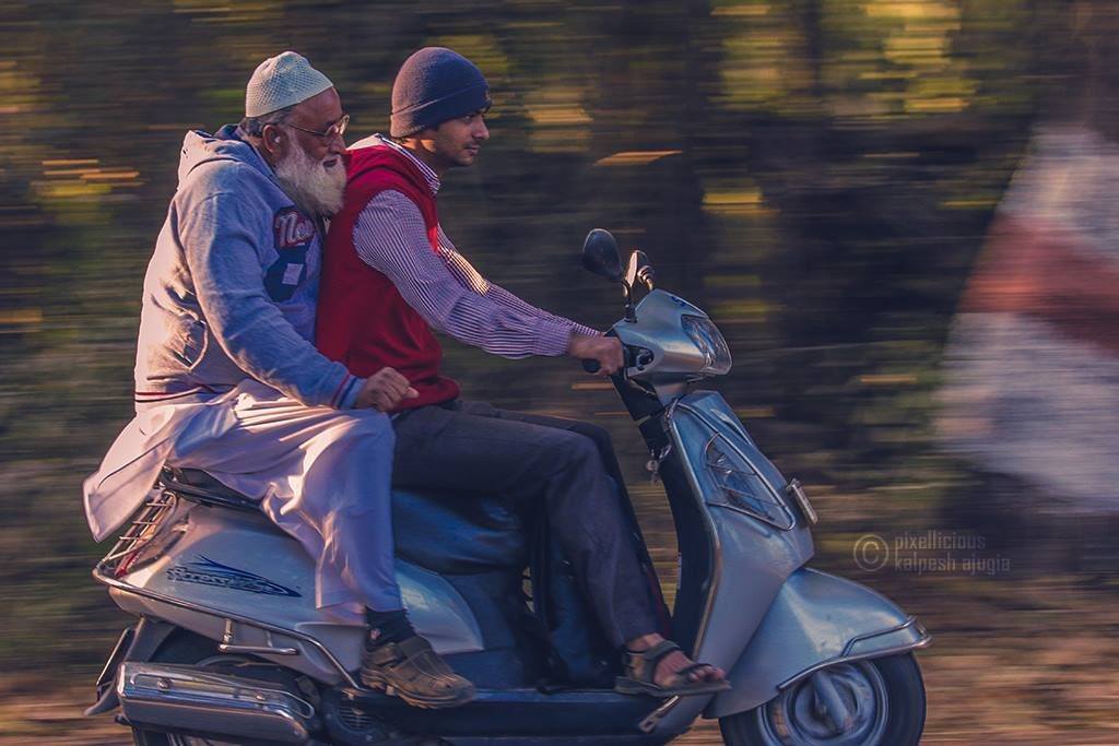 Panning Shot of a Scooter Riders
